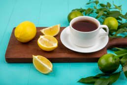 tpf view of coffee and lemon on a brown wooden stand